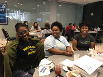 Women smiling during workforce training partnerships event