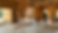 House interior under construction with wood framing and workers