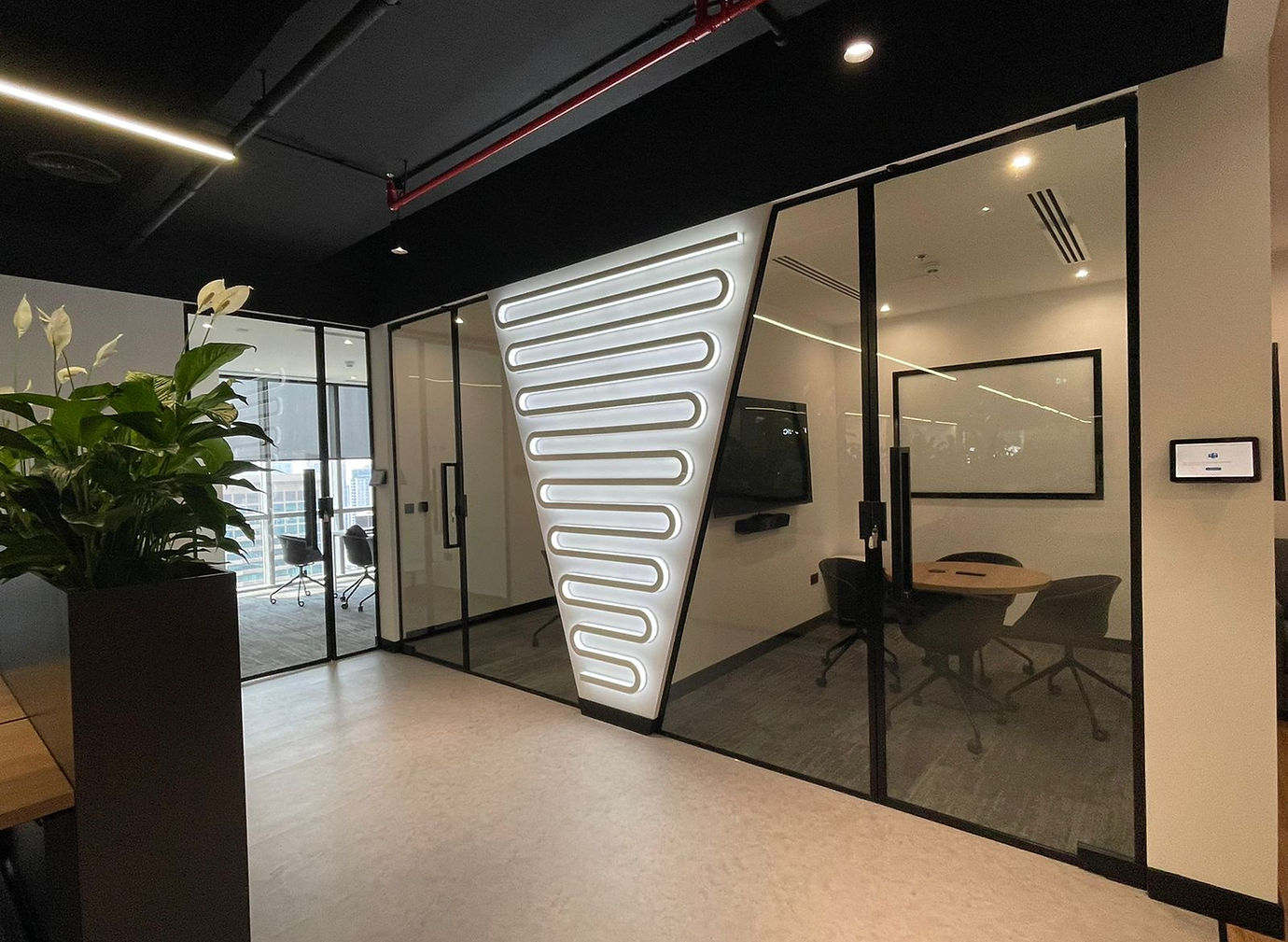 Unifonic FZE open workspace with warm finishes and modern furniture
