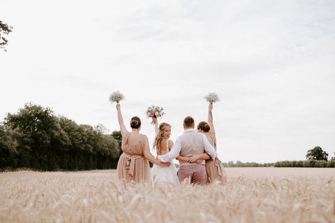 Bride with her bridesmaid in a Norfolk field