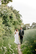 Bride and Groom walking in the Norfolk countryside