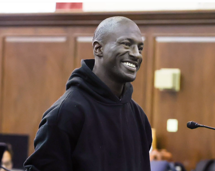 Rhamell Burke smiles at his court hearing.