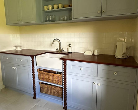 Heritage kitchen with sage cabinetry and timber island bench at Brookland Park Bathurst