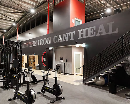 ym floor with equipment and motivational wall graphics at World Gym Bathurst