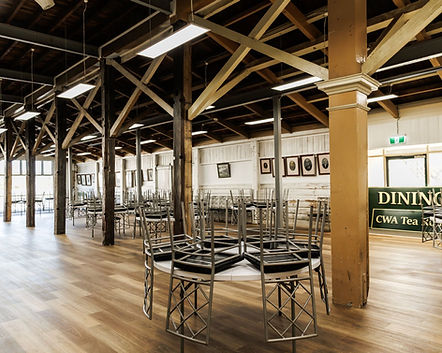Heritage interior with portrait wall and original timber features at The Moxen Bathurst Showground