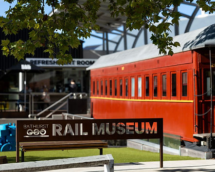 Bathurst Rail Museum signage with restored red heritage train carriage