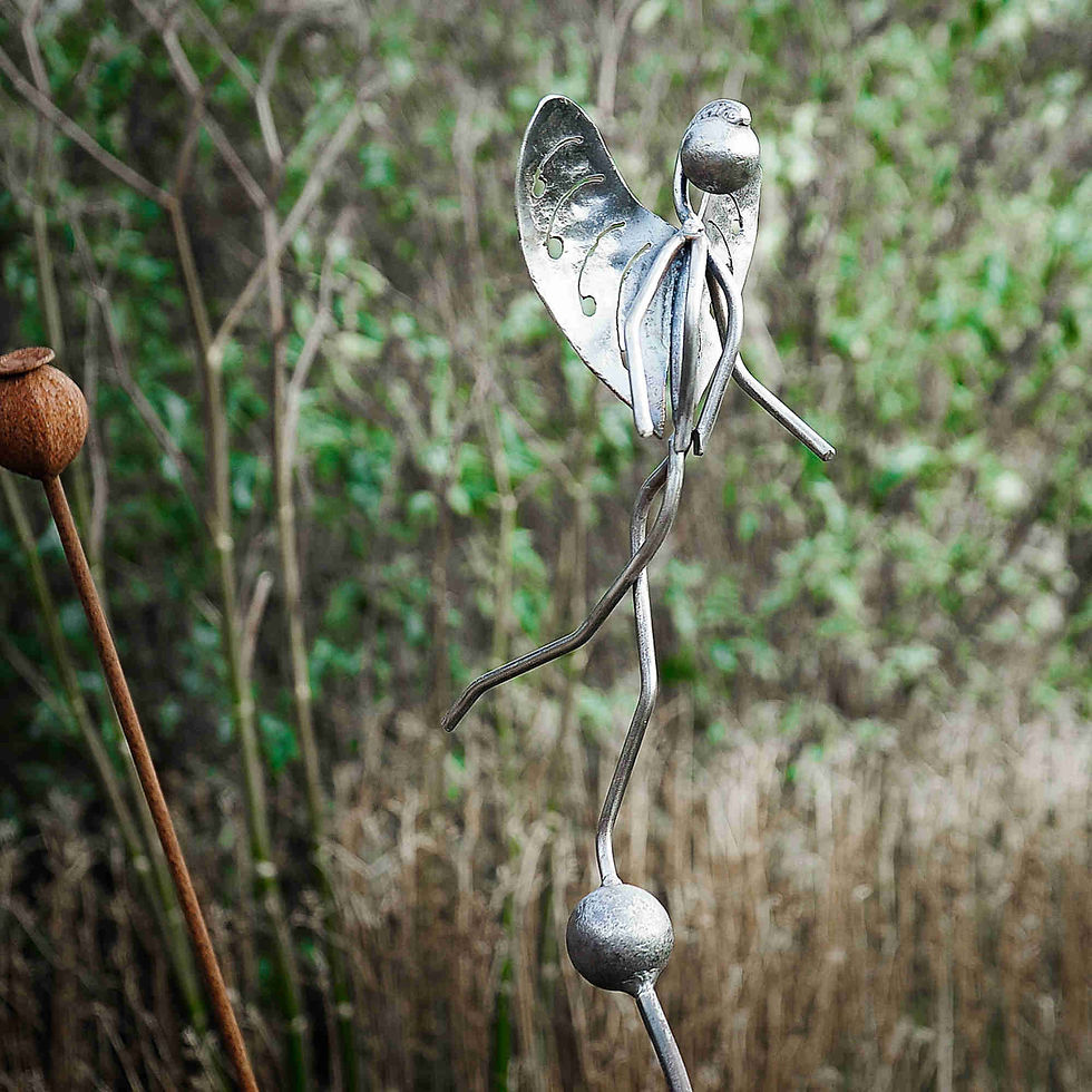 Thumbnail: Stainless Steel Woodland Fairy on Rusty Metal Seed Head side view with ivy background