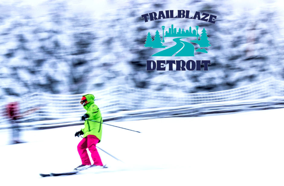 Sunlit forest with a tranquil river, surrounded by autumn foliage in shades of yellow and green. Fallen leaves cover the riverbank. paint creek trail clinton river pure michigan visit detroit expedition detroit trailblaze detroit