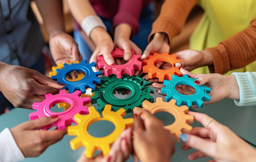 Hands from many people, holding cogs and bringing them together in collaboration