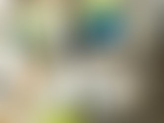 Construction team wearing hard hats reviewing building blueprint, in collaboration on a project