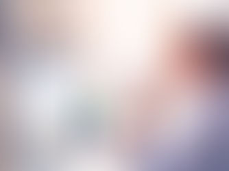 A woman at a desk, working on a project Gantt chart