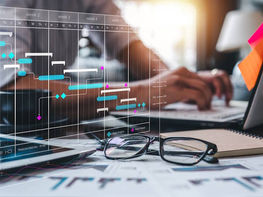 A person working on a project management Gantt chart