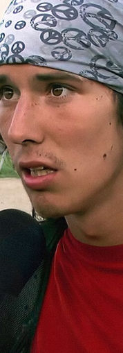 Netflix title: The Hatchet Wielding Hitchhiker, man with microphone.