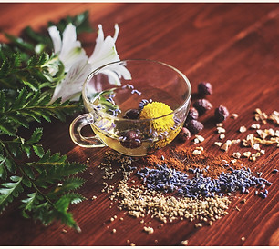 Clear glass tea cup on a table with ground spices