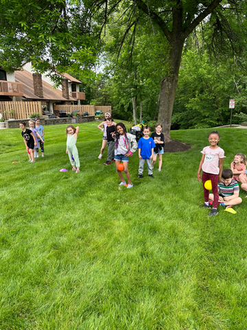 Children playing in Field Day relay races.