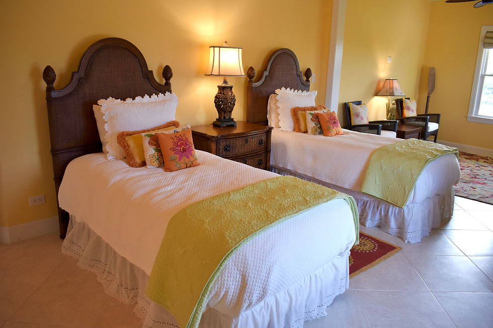 3. Cozy Twin Beds with Island-Inspired Decor