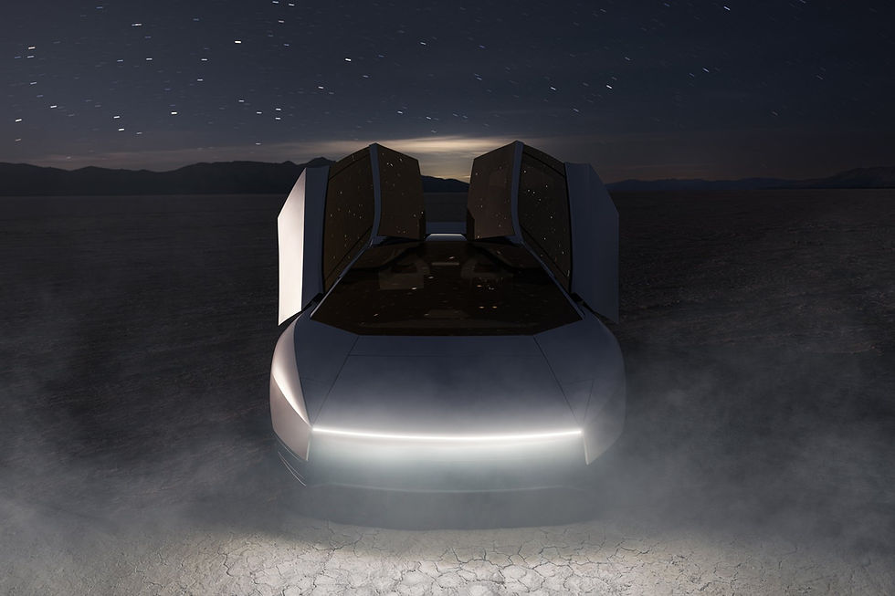 The Tesla Roadster at night on a dry lakebed with both doors raised