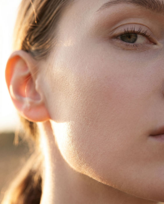 Close-up profile of AI female model highlighting natural skin finish for beauty campaign by Vertigini Studio