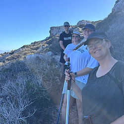 happy hikers at Aforesmenos lighthouse hiking trail path
