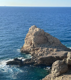 Raw nature with waves and rocks at Aforesmenos lighthouse trail