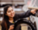 Smiling woman holding the door of a washing machine Careers In Store – Learning and Development
