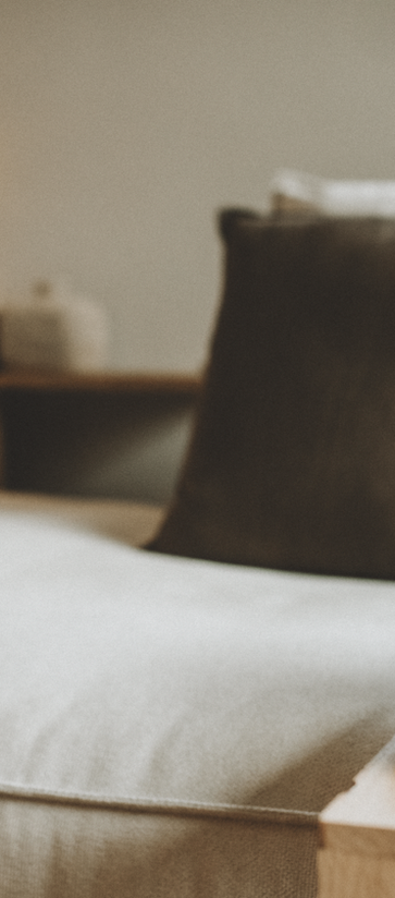 Soft styled scene with handmade jewellery, yarn and calm home decor in natural light.