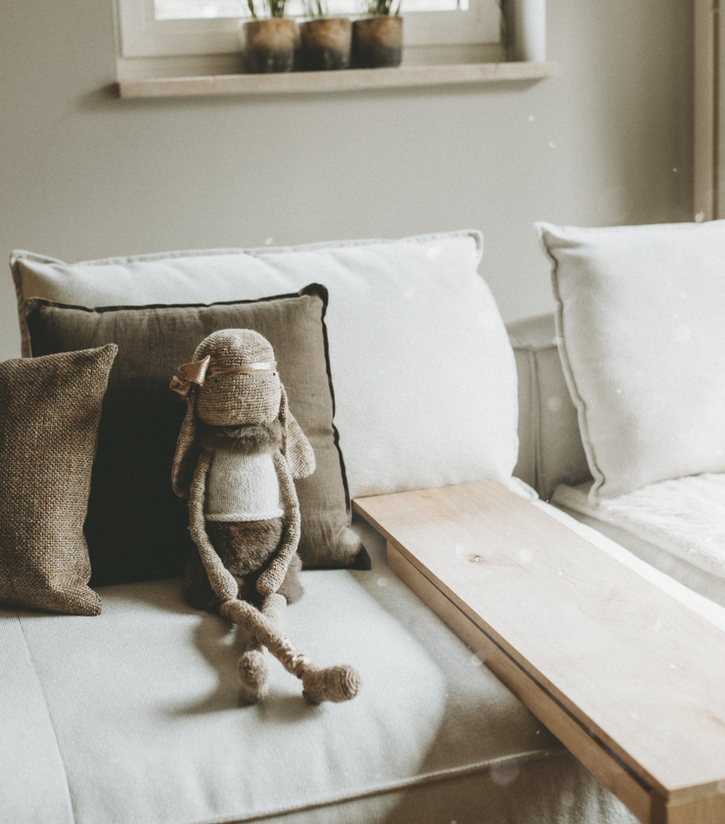 Soft styled scene with handmade jewellery, yarn and calm home decor in natural light.