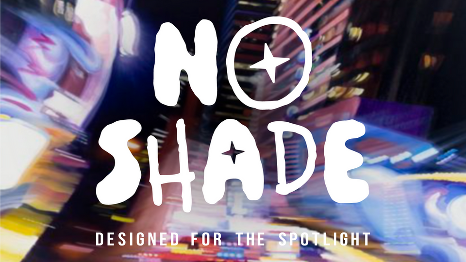 white logo on blurry city background