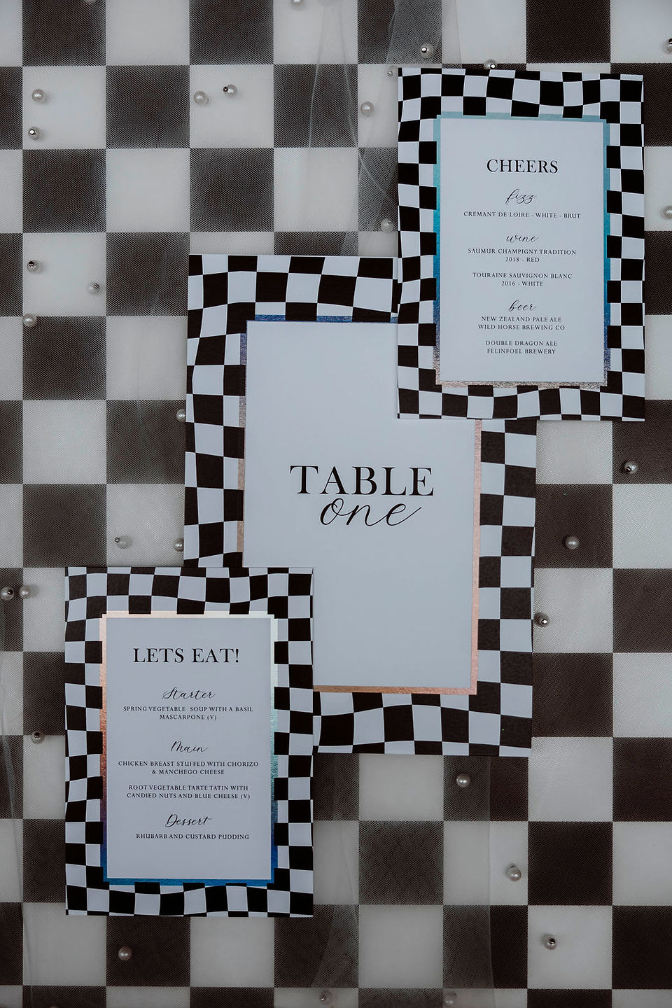 Checkerboard wedding menu and table one details