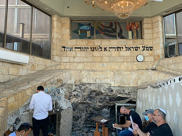 Praying at tomb R' Akiva.jpeg