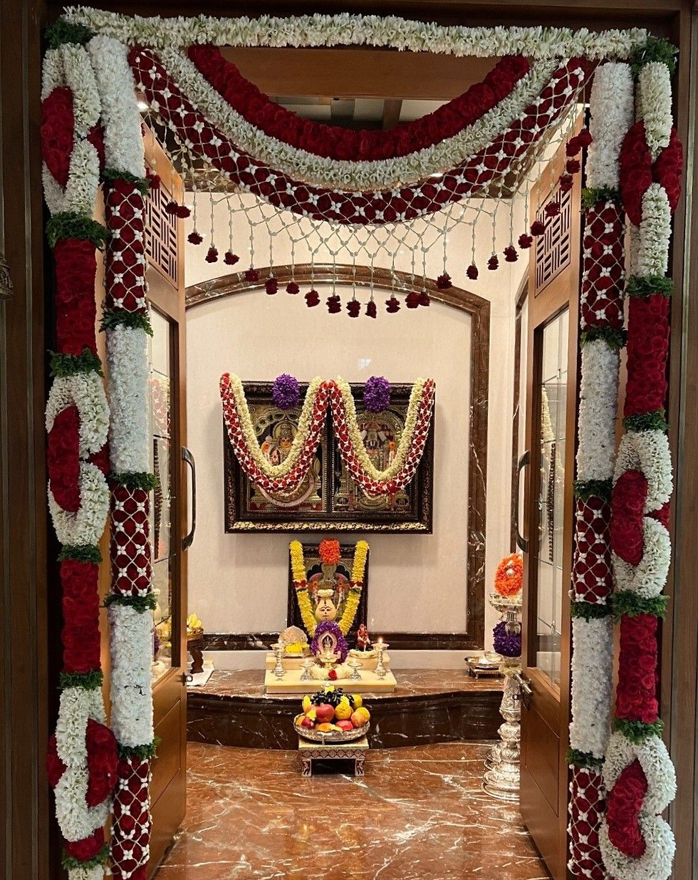 Traditional House Warming decoration with floral garlands and ceremonial setup.