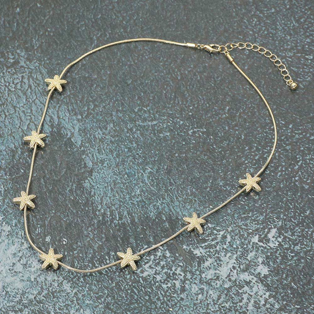 Gold textured metal starfish Necklace