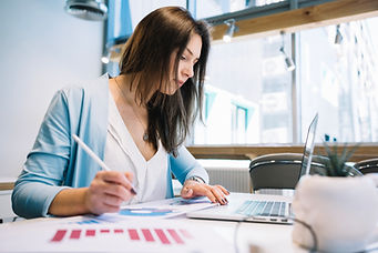 woman-with-pen-using-laptop.jpg