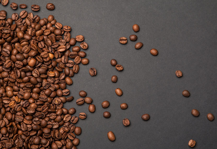 coffee-beans-on-a-grey-surface-2023-05-11-19-16-01-utc.jpg