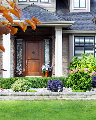 A picture of a house taken from the front.