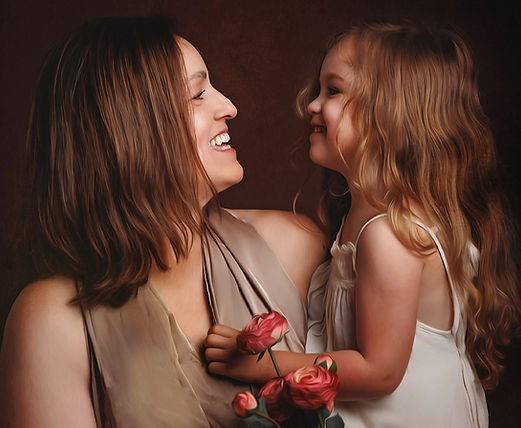 mother and daughter gazing at eachother during a motherhood portrait studio session