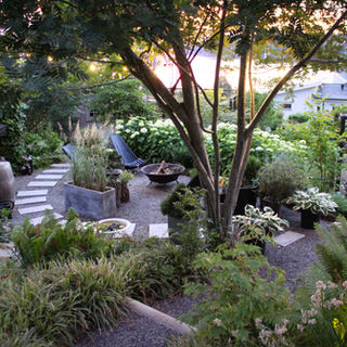 landscape architecture with a fireplace, stairs, trees and hydrangeas