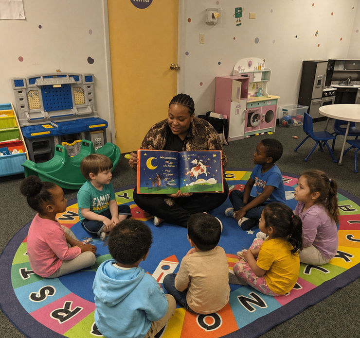 kid in circle in front of teacher