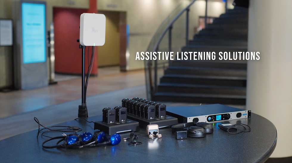 Assistive listening equipment display with hearing loop receivers, Auracast transmitter, wireless receivers, earbuds, and audio hardware for public venue accessibility.