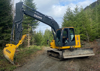 excavator on service road during road clean up and refresh