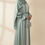 Thumbnail: moddel wearing and posing in Jawahir Luxury Abaya in mint green