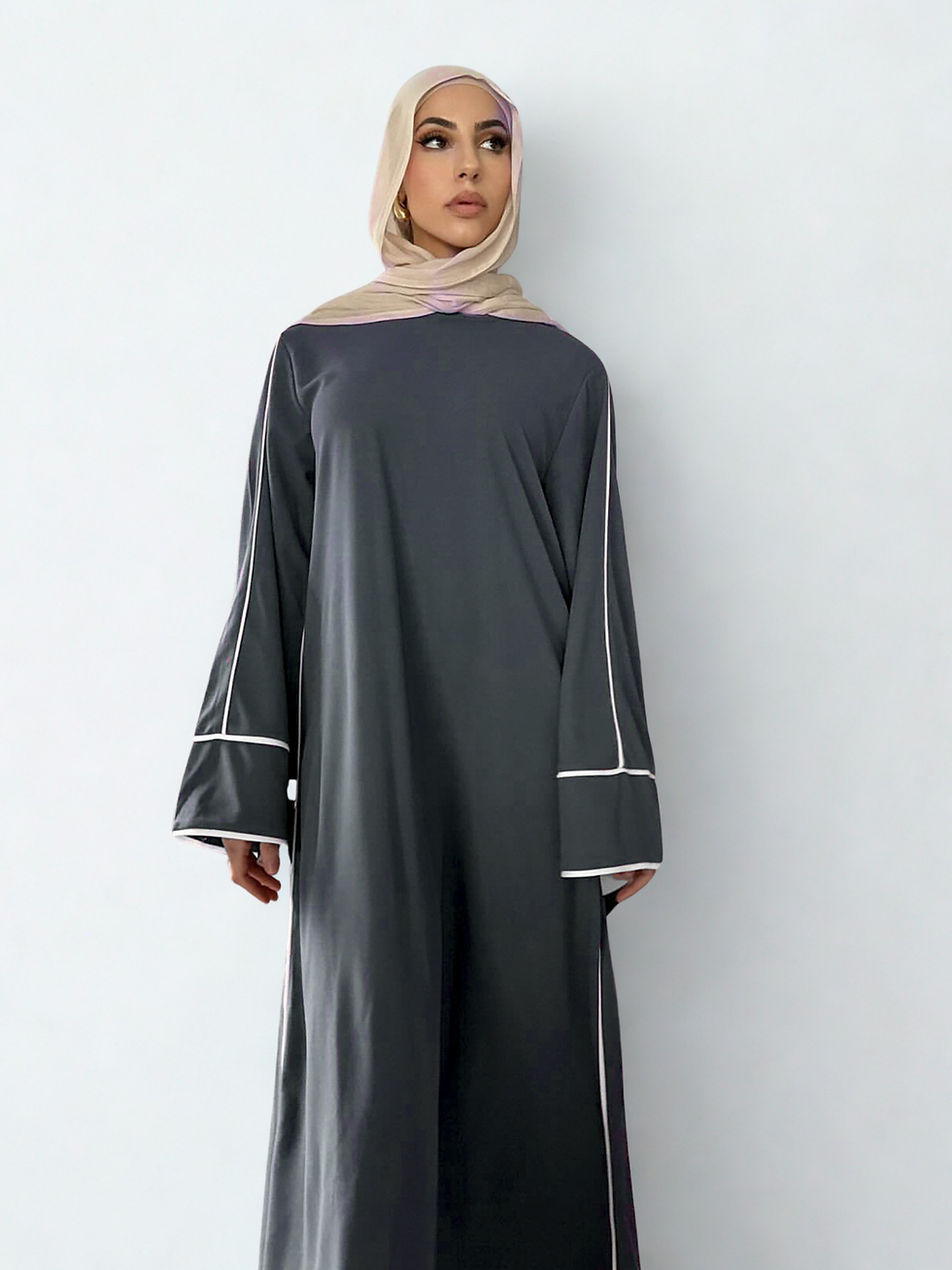 Thumbnail: Model posing in Jamila Abaya in Grey colour looking at the camera