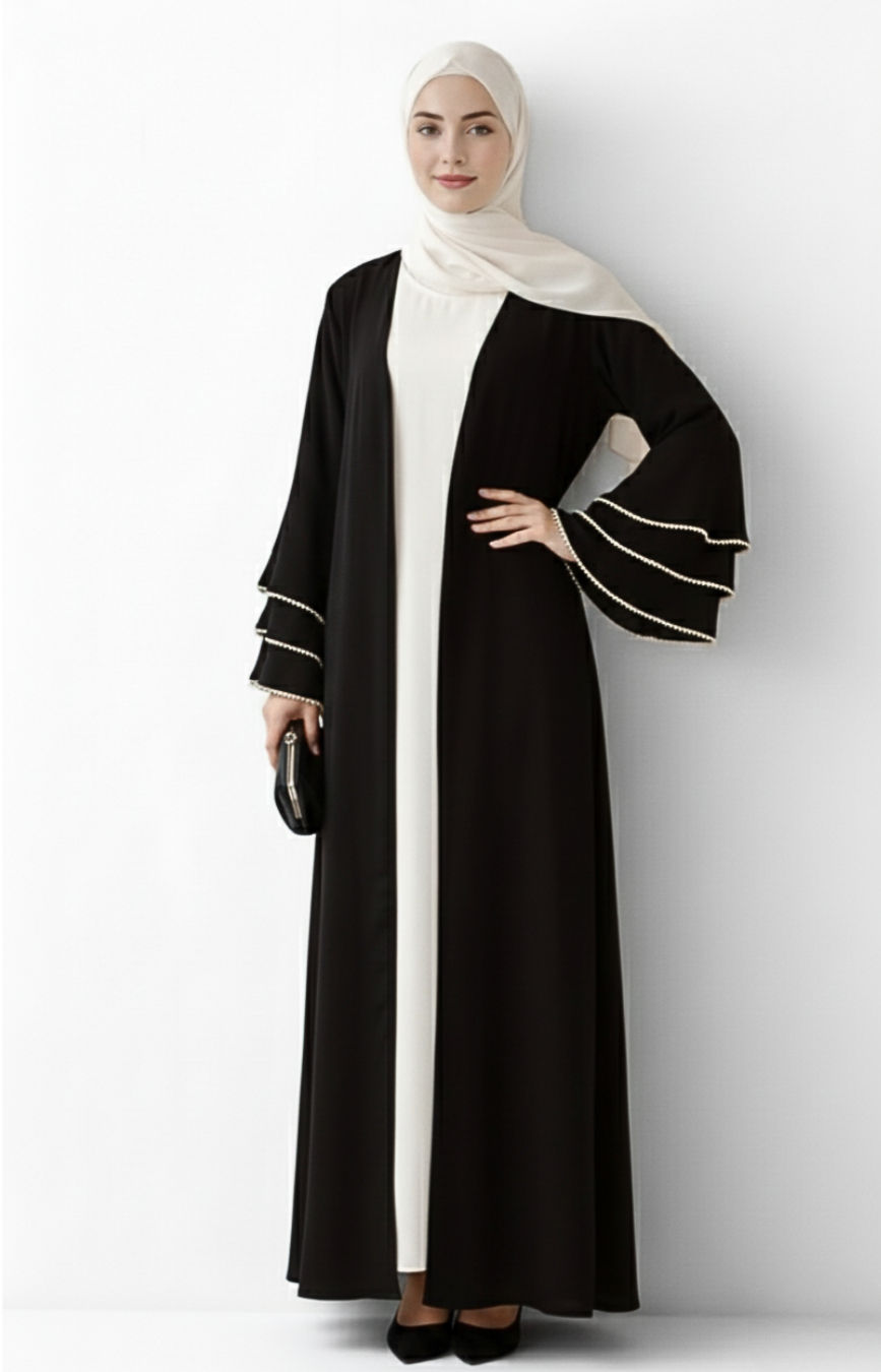 Model wearing Luluah Open Abaya and posing while putting hand on waist