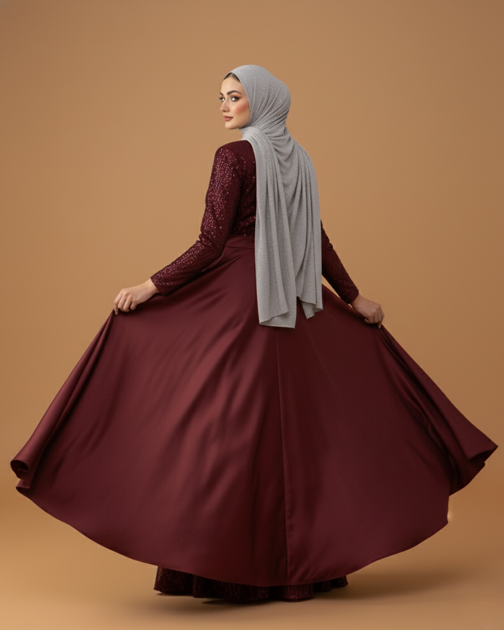 Thumbnail: Model wearing Lujain Celeste Gown in burgundy