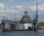 A military ship in a floating drydock