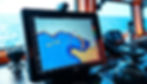 Backup ECDIS screen displaying a nautical chart on a ship's bridge, highlighting navigational routes and key locations.