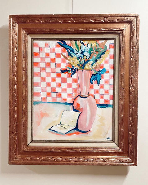 Chicago Artist displays a pink painting with a vase of abstract flowers and a note that says, I miss you. 