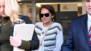 An accused killer cop's mother just walked out of court on bail