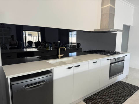 Dark mirror look glass splashback Bunbury WA modern kitchen