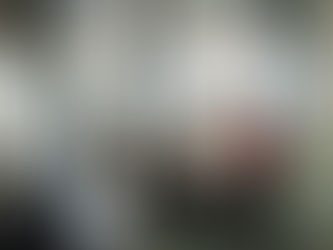 A group of workers sat around a table in an office